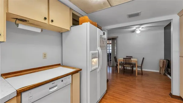 a view of dining room with furniture and wooden floor