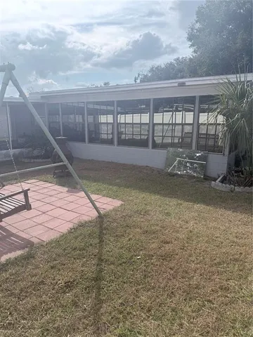 a view of backyard and garage