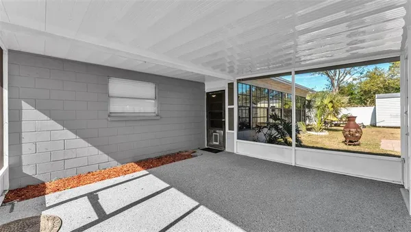 a view of an empty room with windows