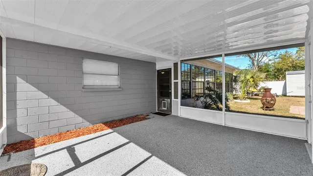 a view of an empty room with windows