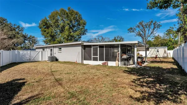 a view of a house with a yard and garage