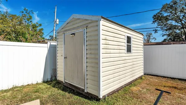 a view of a back yard of the house