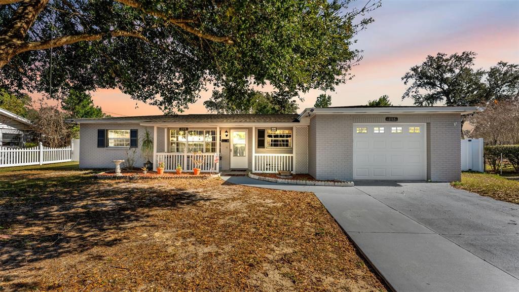 115 Morrow Circle Brandon, FL 33510 - Photo 44 of 48 a front view of a house with a garden
