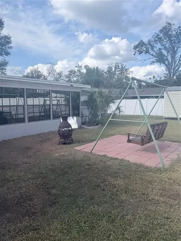 a living room with a large window and a table