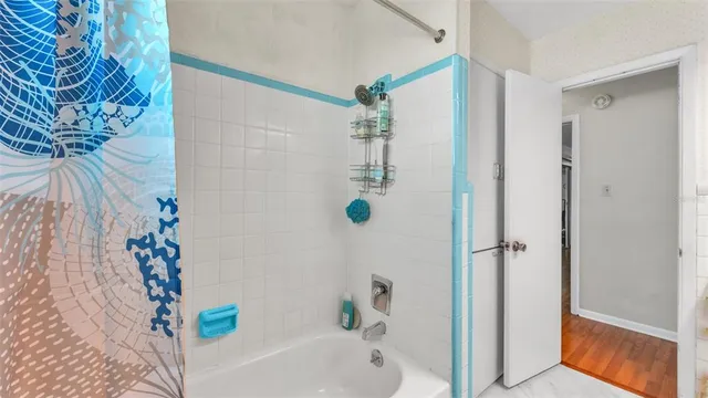 a bathroom with a bathtub and shower