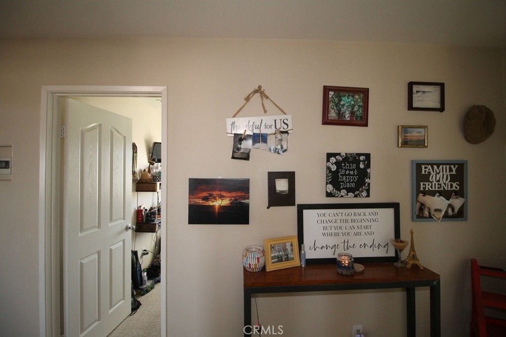924 Condor Street Barstow, CA 92311 - Photo 43 of 52 a living room with furniture and paintings on the wall