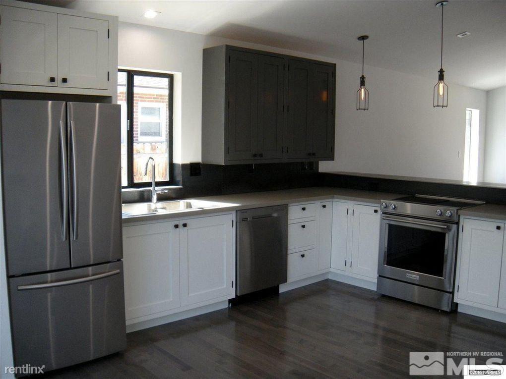 616 Thoma Street Reno, NV 89502 - Photo 2 of 11 a kitchen with a sink stove and microwave