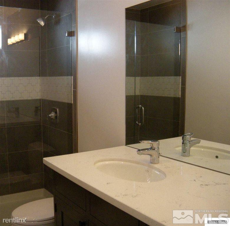 616 Thoma Street Reno, NV 89502 - Photo 9 of 11 a bathroom with a sink a toilet and shower