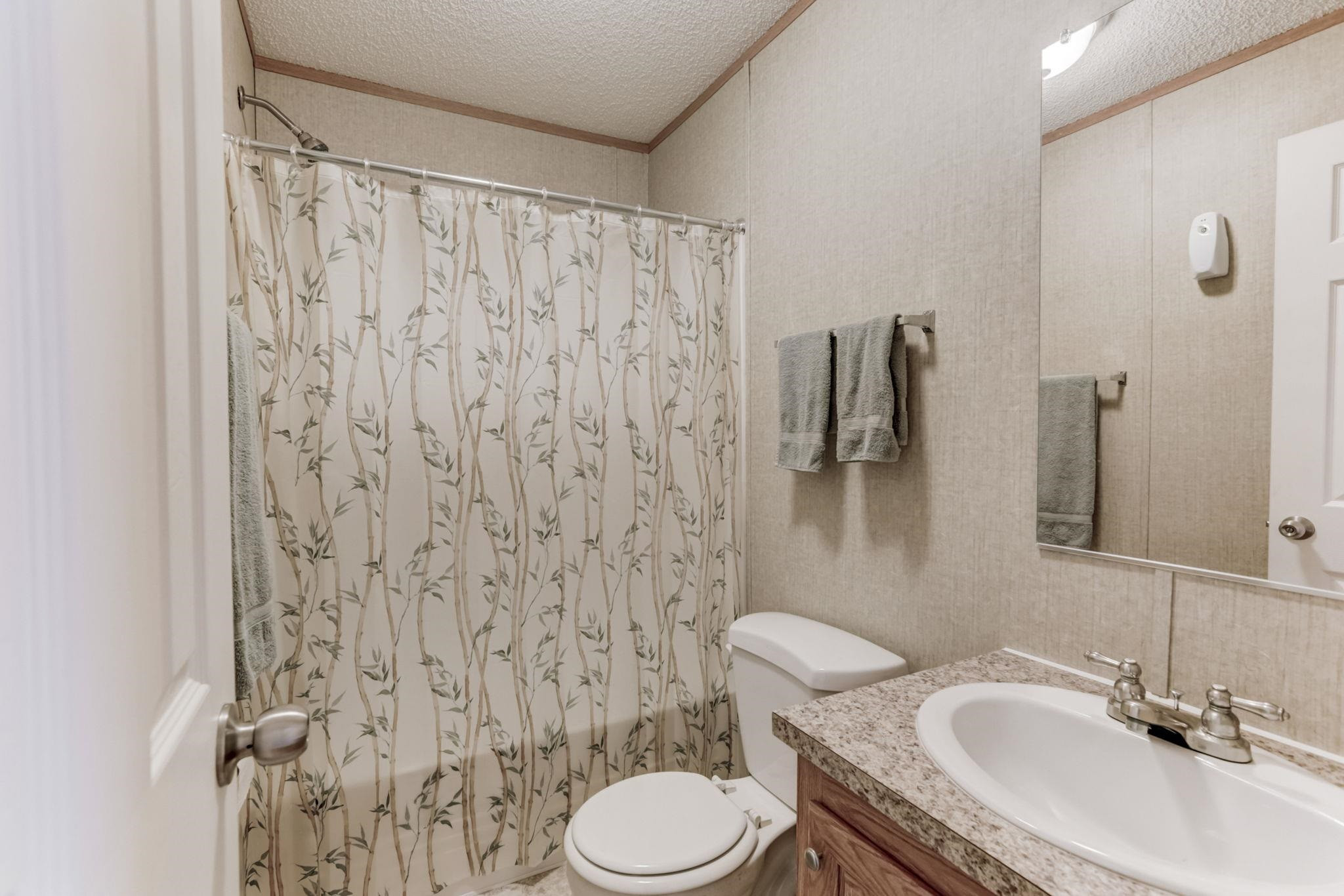 257 Marvin Gill Road Roxboro, NC 27574 - Photo 14 of 34 a bathroom with a sink and a toilet