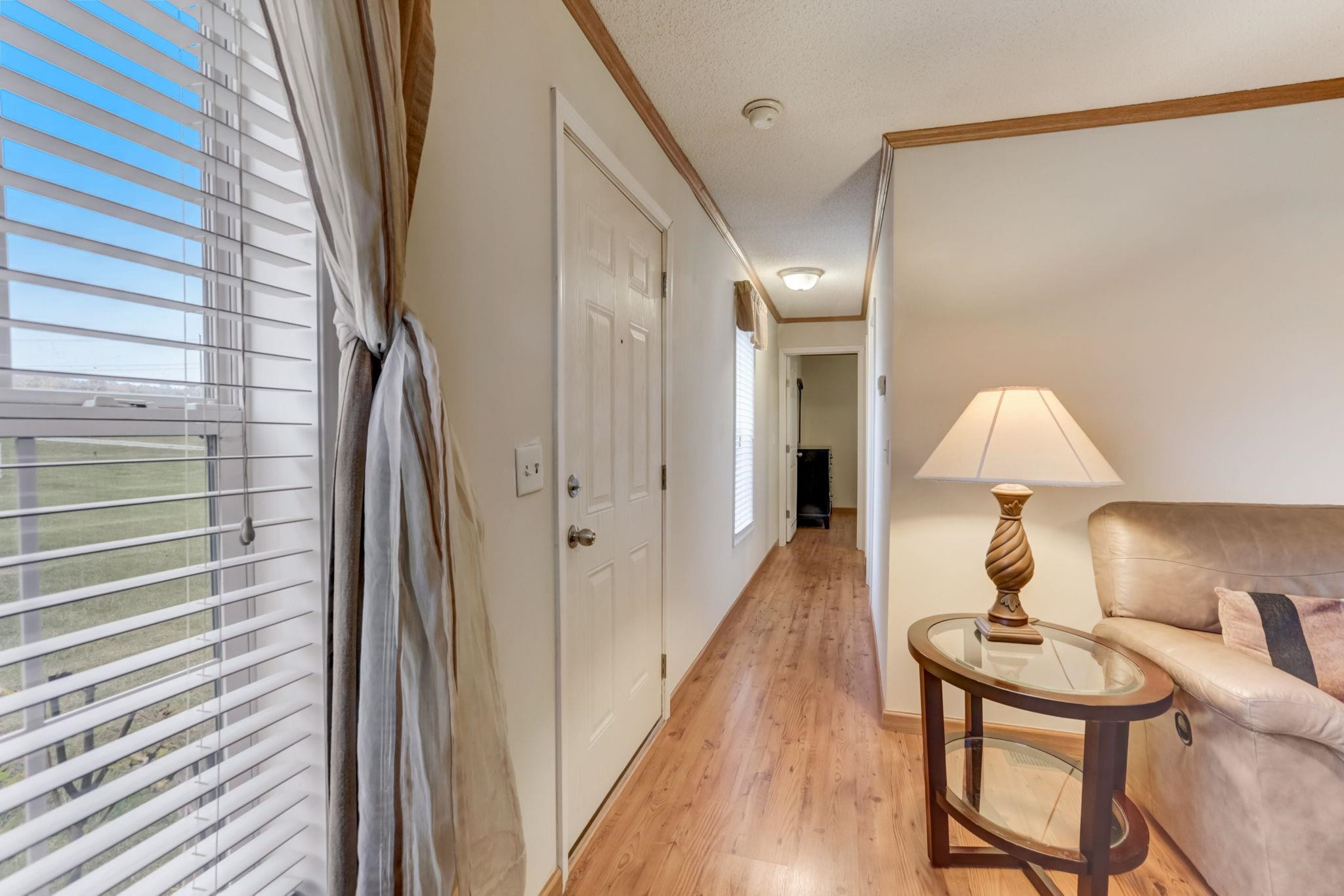 257 Marvin Gill Road Roxboro, NC 27574 - Photo 20 of 34 a view of a hallway with furniture and wooden floor