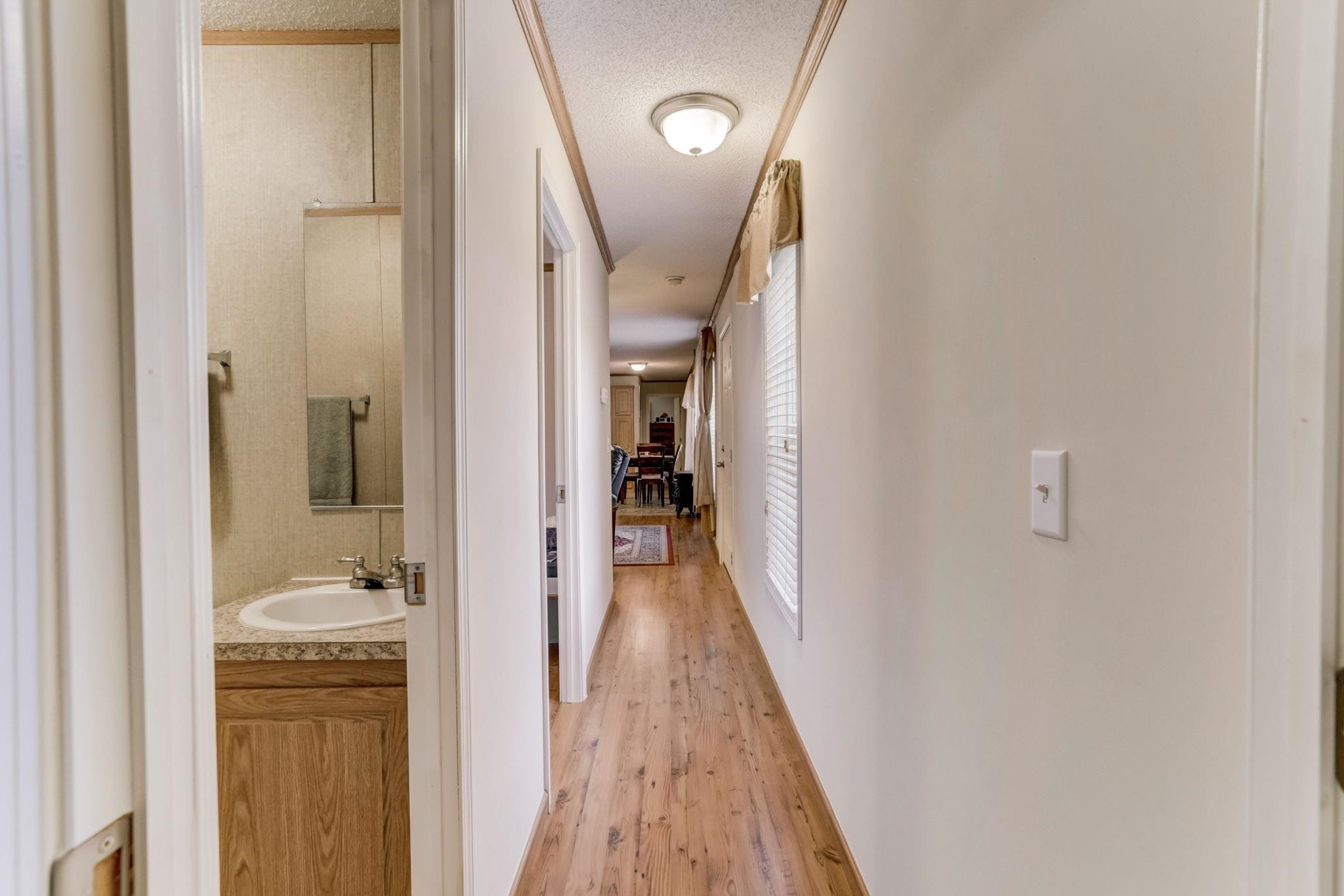 257 Marvin Gill Road Roxboro, NC 27574 - Photo 21 of 34 a view of a hallway with wooden floor and staircase