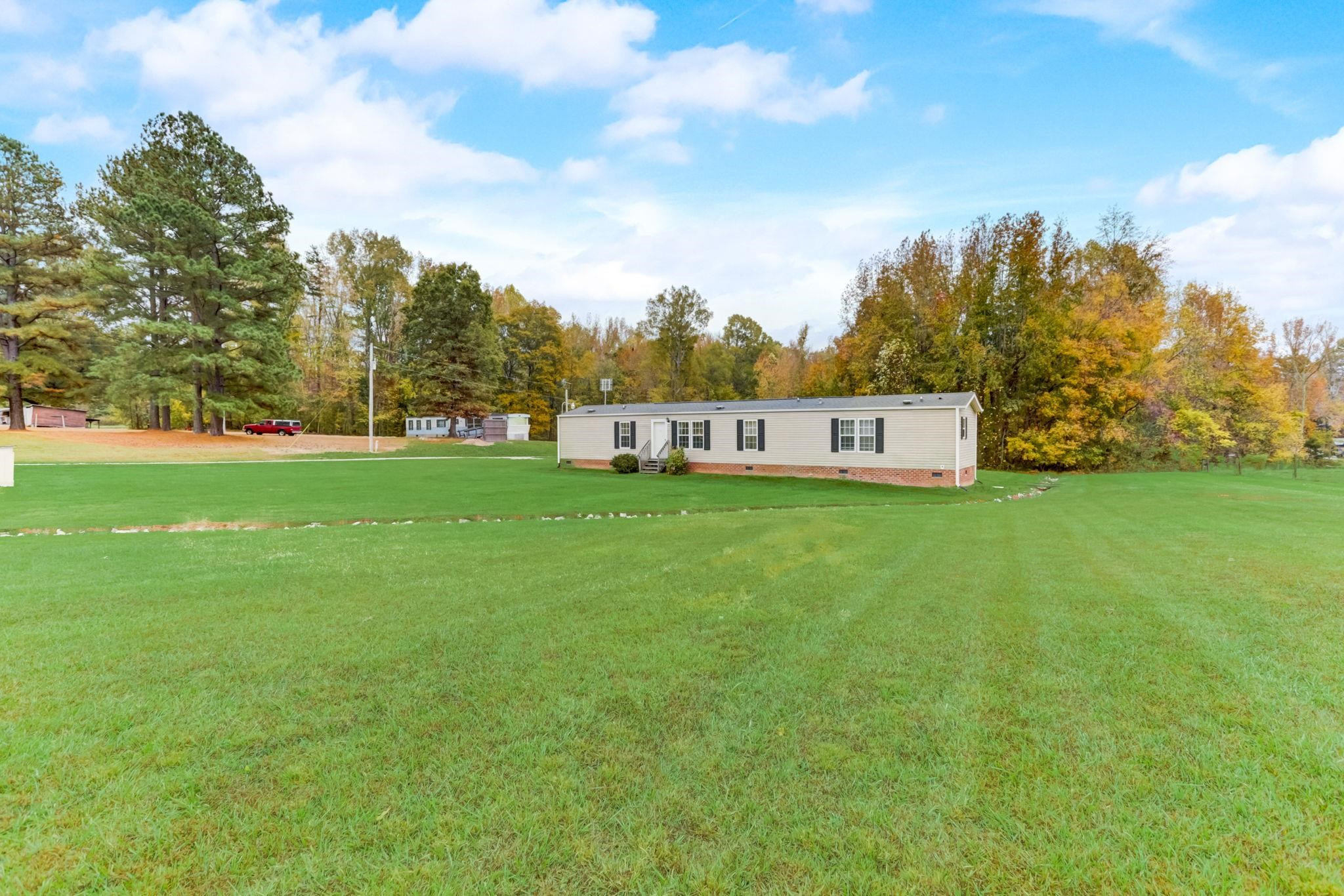 257 Marvin Gill Road Roxboro, NC 27574 - Photo 24 of 34 a view of a big yard with palm trees