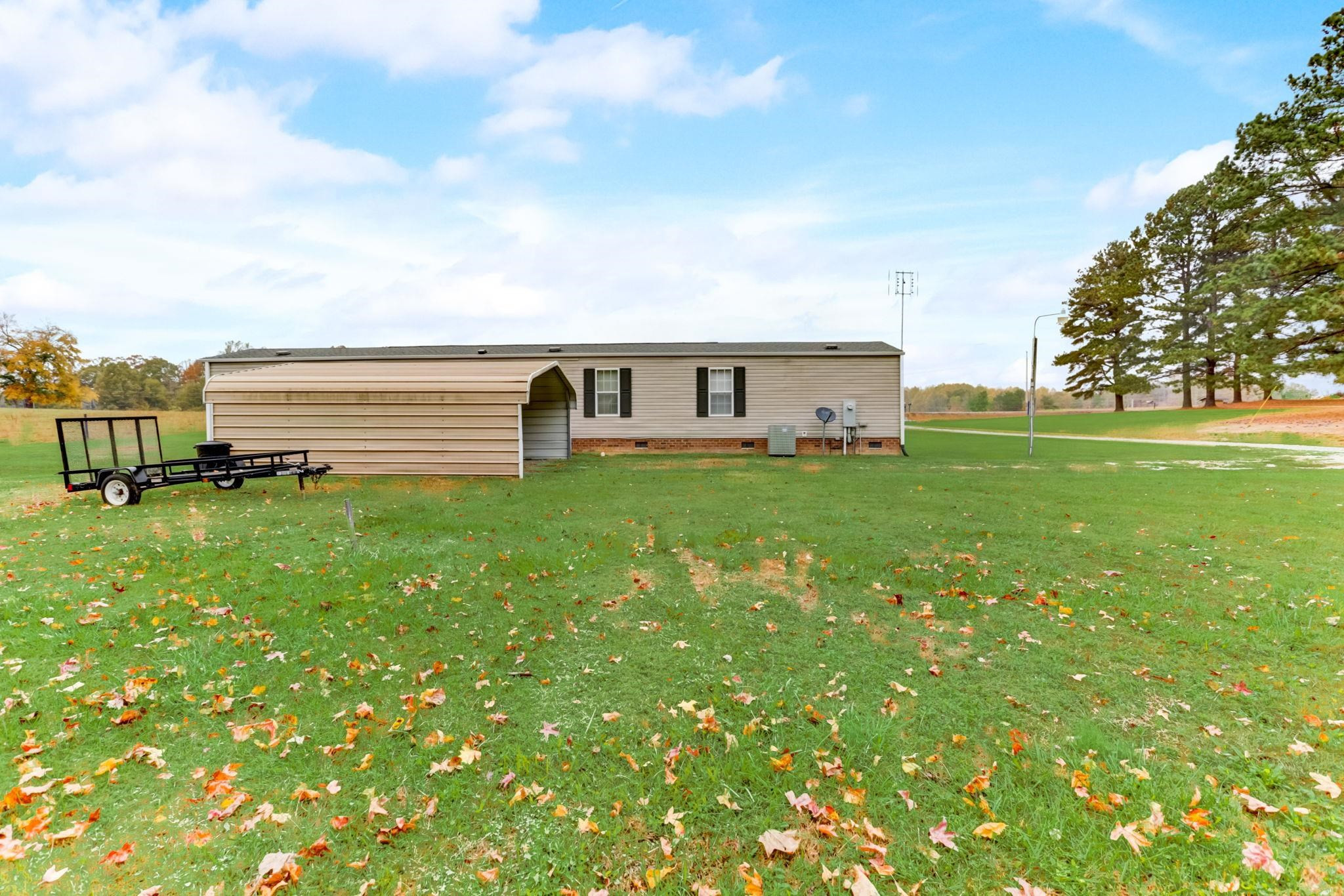 257 Marvin Gill Road Roxboro, NC 27574 - Photo 29 of 34 a view of a house with a big yard and large trees