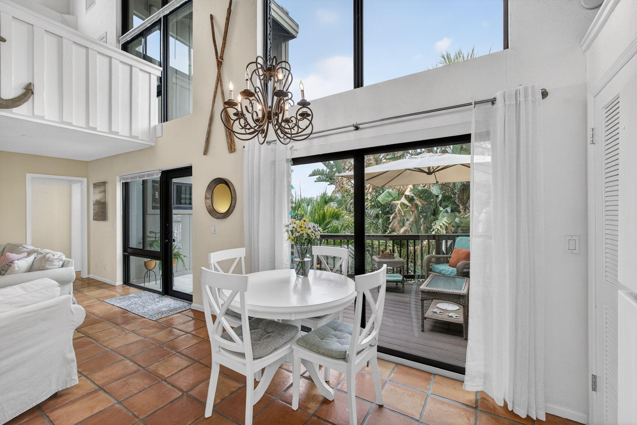 1605 Highway 1, Unit 14E Jupiter, FL 33477 - Photo 11 of 34 Dining with sunny courtyard views