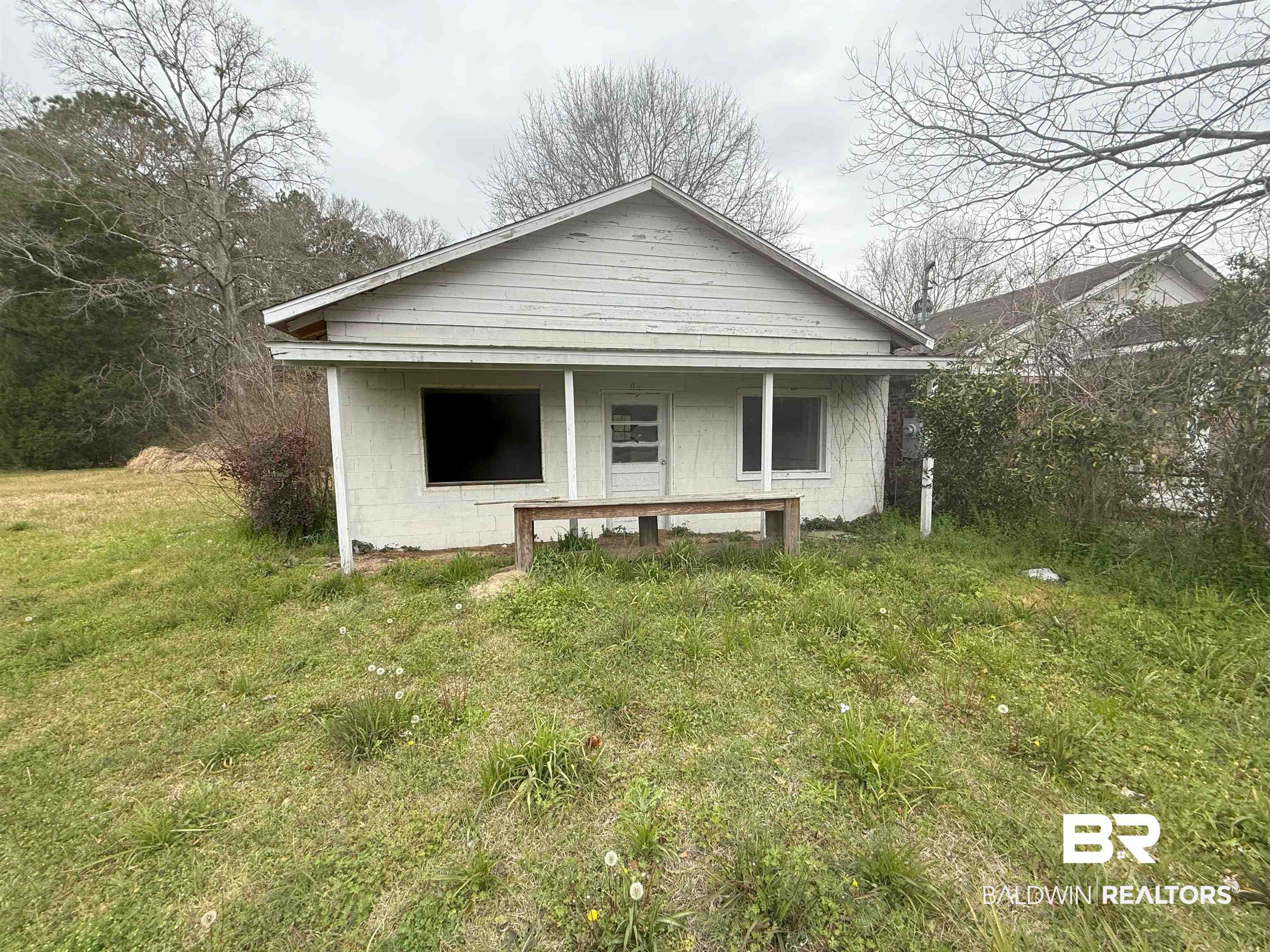 1166 Military Rd Mount Mount Vernon, AL 36560 - Photo 1 of 9 Rear view of house with a porch and concrete block siding