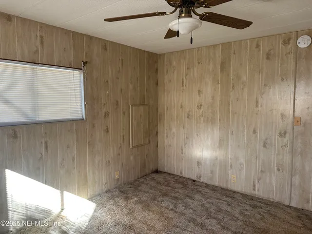 a view of empty room with a window