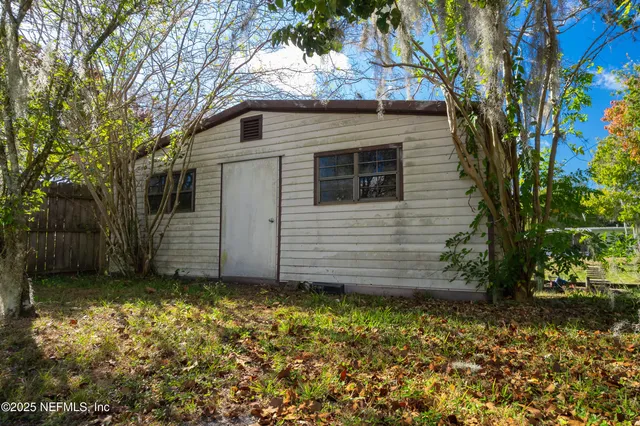 a view of a house with a small yard