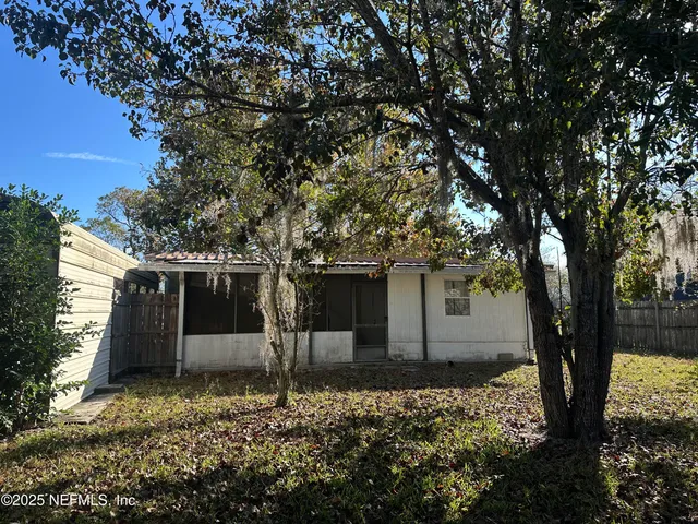 a house with trees in front of it