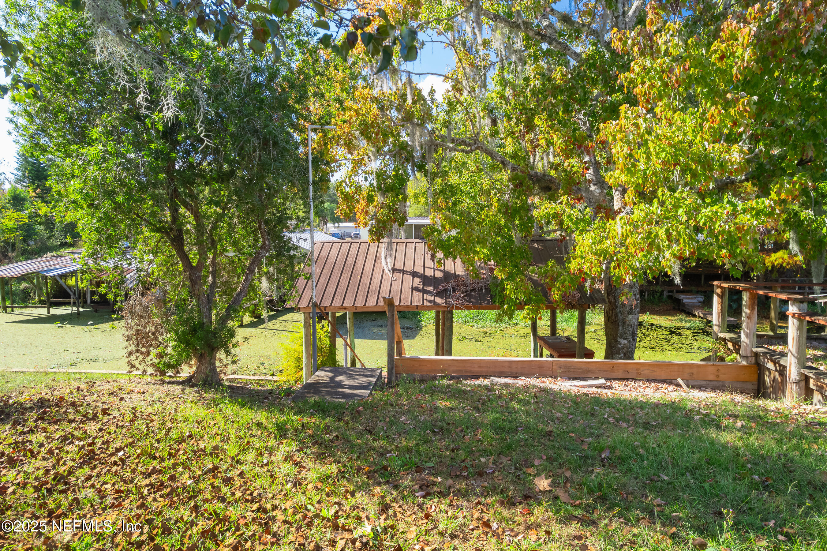125 Waterside Avenue Satsuma, FL 32189 - Photo 21 of 32 a front view of a house with a yard