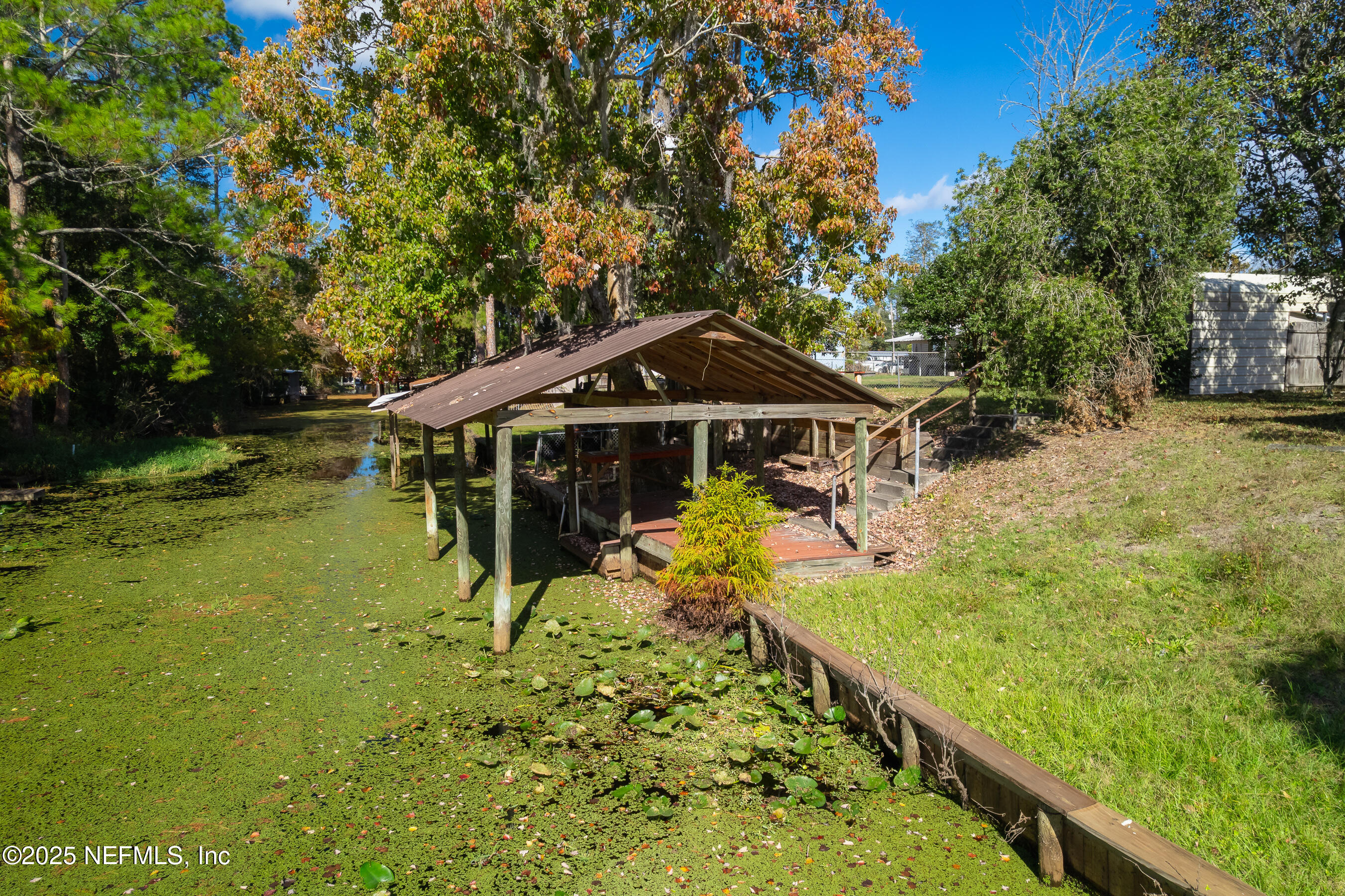 125 Waterside Avenue Satsuma, FL 32189 - Photo 25 of 32 a house view with a garden space