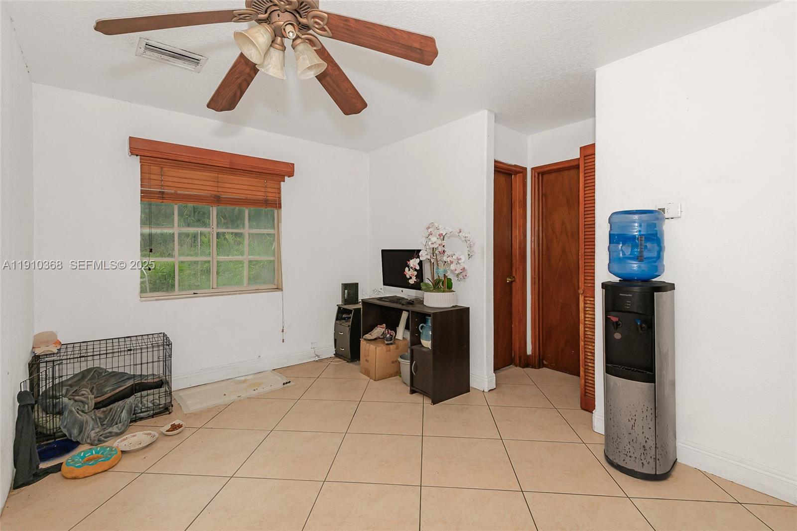 18890 Southwest 184th Street Miami, FL 33187 - Photo 11 of 37 a kitchen with stainless steel appliances kitchen island granite countertop a refrigerator and a stove top oven