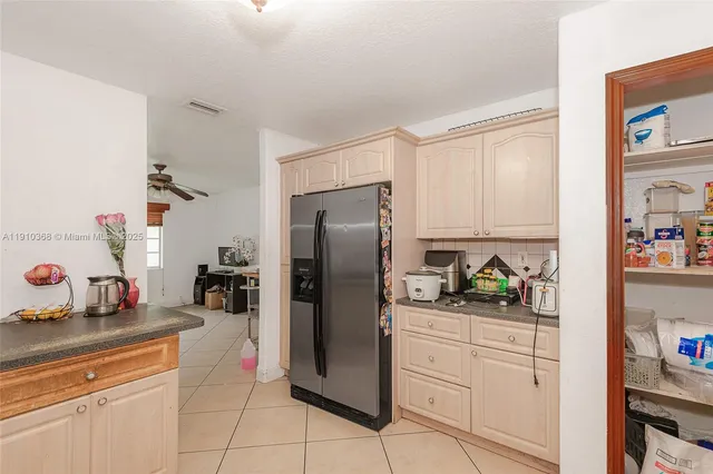 a dining room with furniture and chandelier