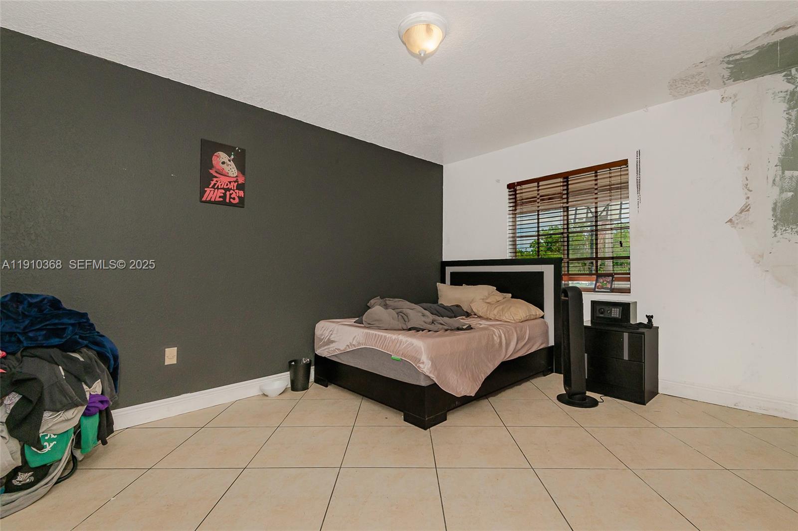 18890 Southwest 184th Street Miami, FL 33187 - Photo 25 of 37 a bedroom with a bed and a window