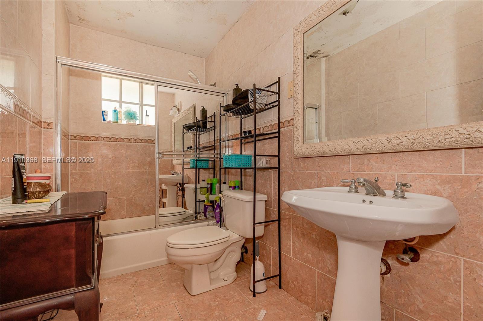18890 Southwest 184th Street Miami, FL 33187 - Photo 28 of 37 a bathroom with a sink toilet and shower