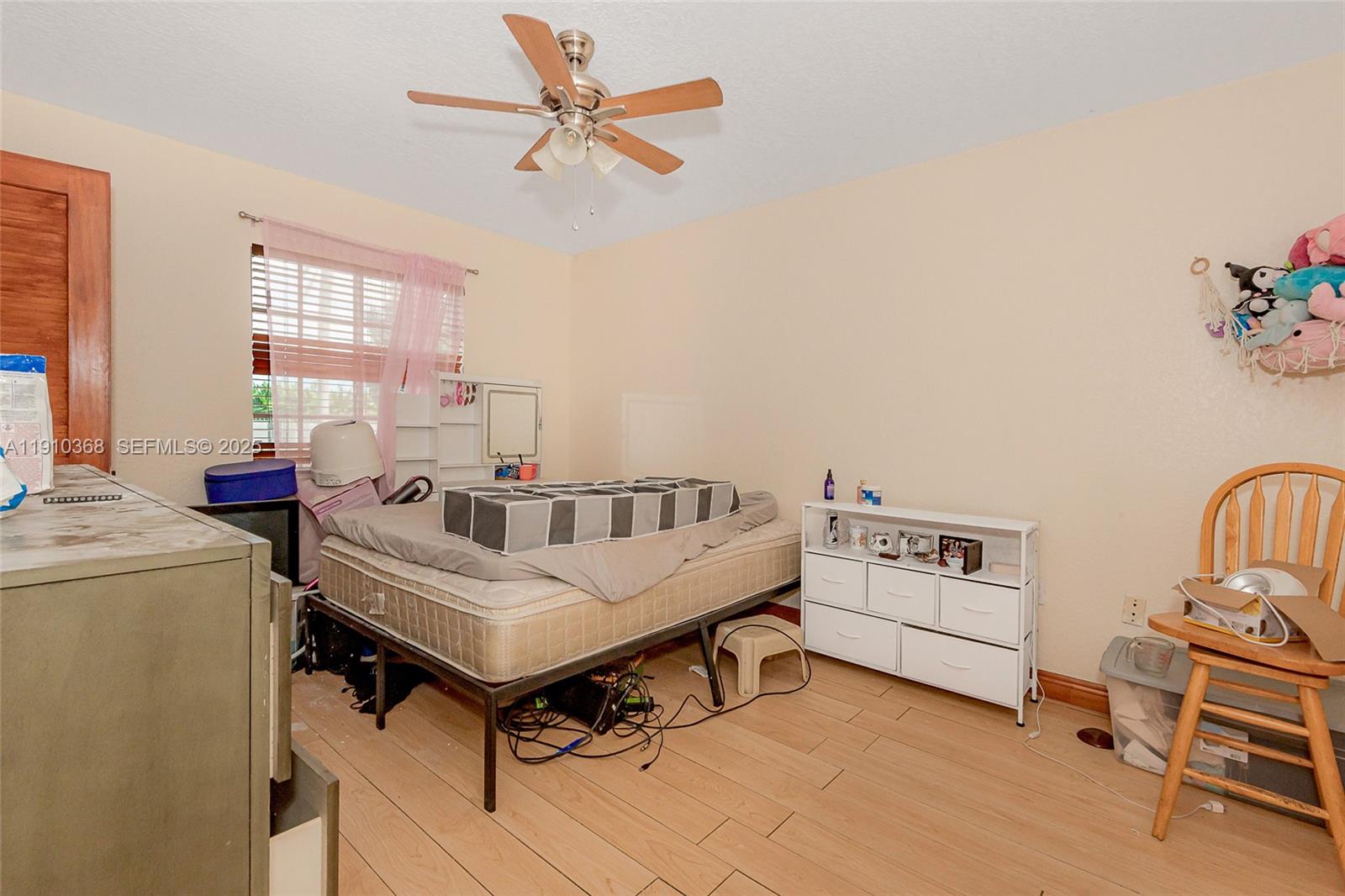 18890 Southwest 184th Street Miami, FL 33187 - Photo 29 of 37 a room with furniture and window