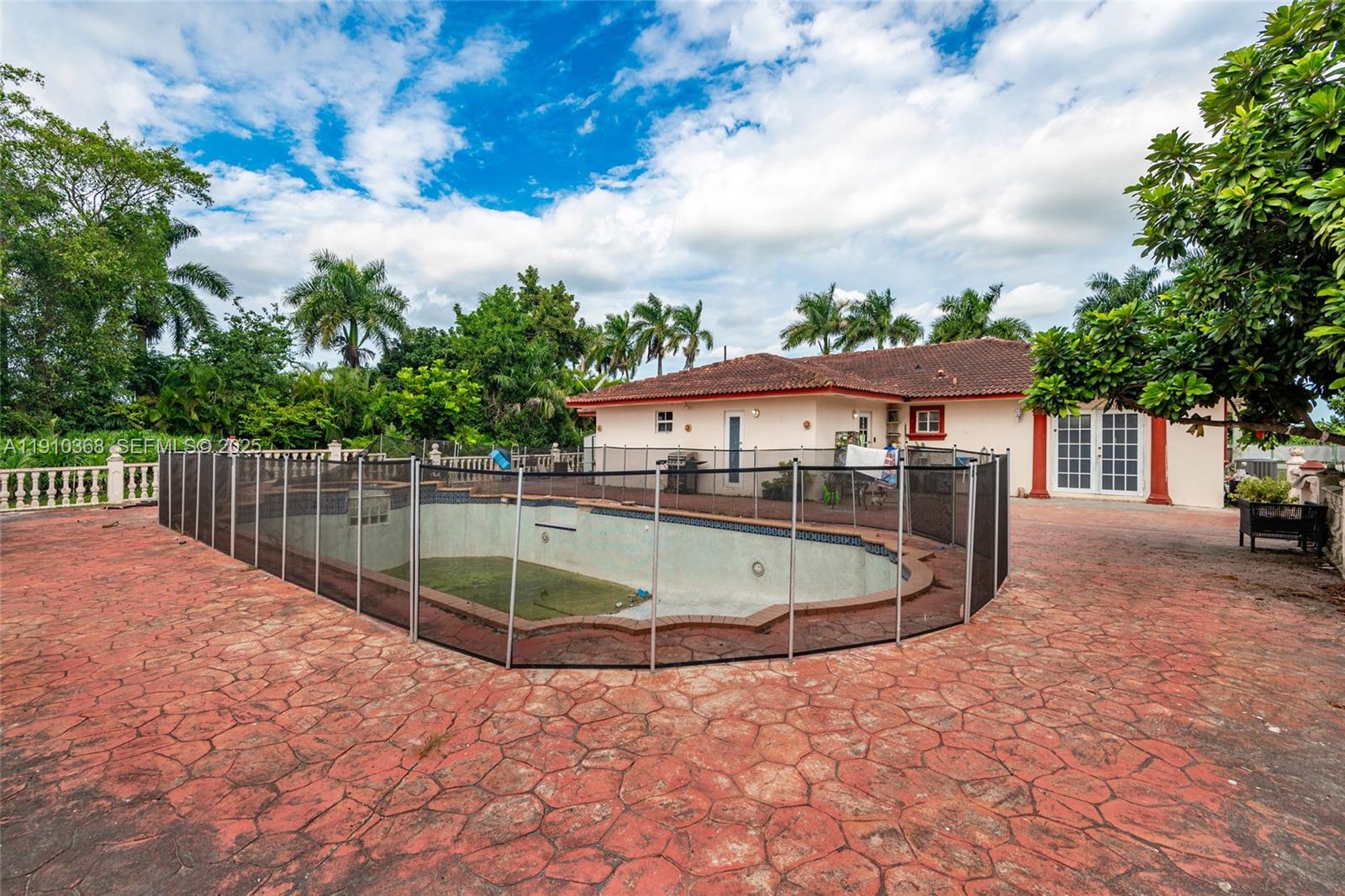 18890 Southwest 184th Street Miami, FL 33187 - Photo 33 of 37 a view of a swimming pool with a patio