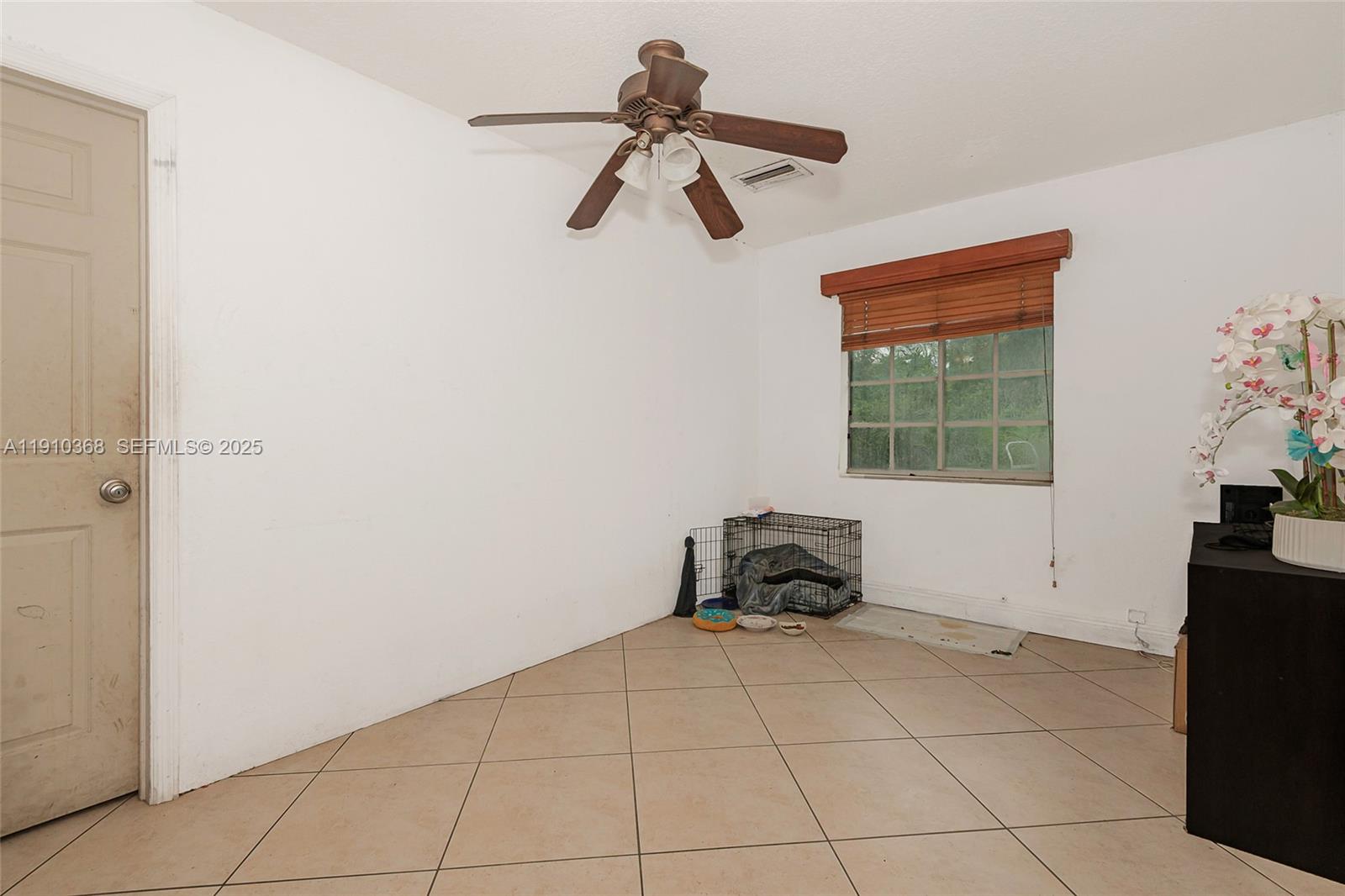 18890 Southwest 184th Street Miami, FL 33187 - Photo 5 of 37 a living room with a window