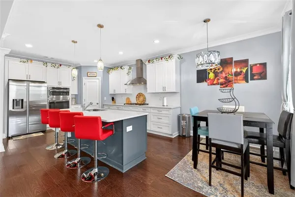 a room with kitchen island granite countertop lots of counter top space