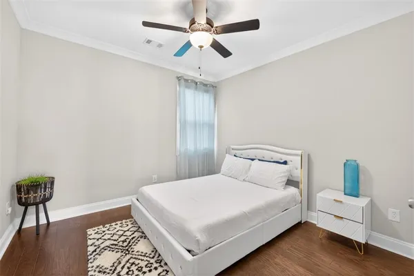 a bathroom with a granite countertop toilet sink and a mirror