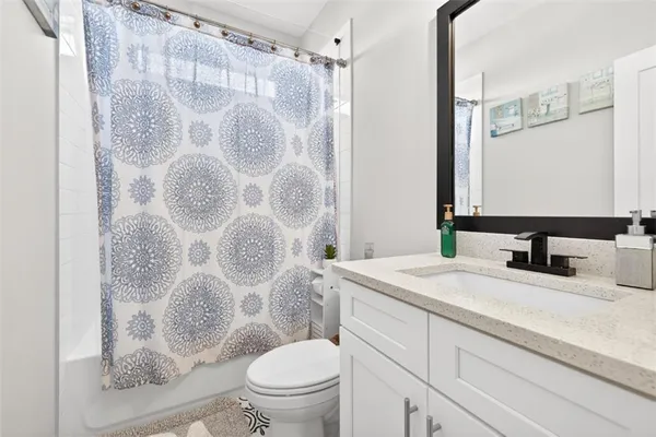 a bedroom with a large bed and a large window