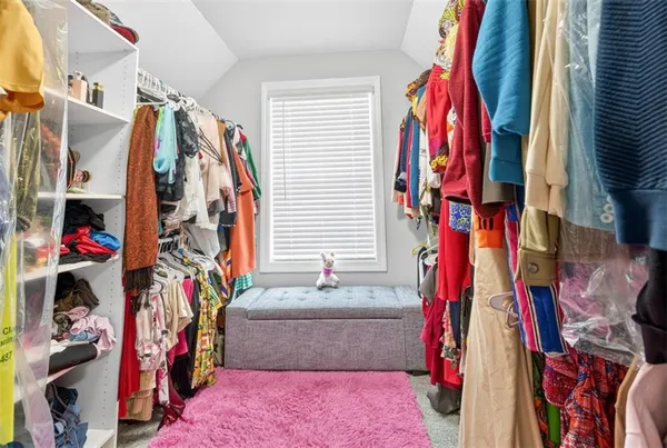 a store room with lots of clutter and cabinets