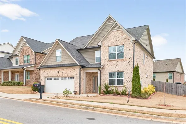 front view of a house with a yard