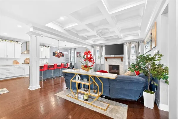 a view of a dining room with furniture wooden floor and a chandelier