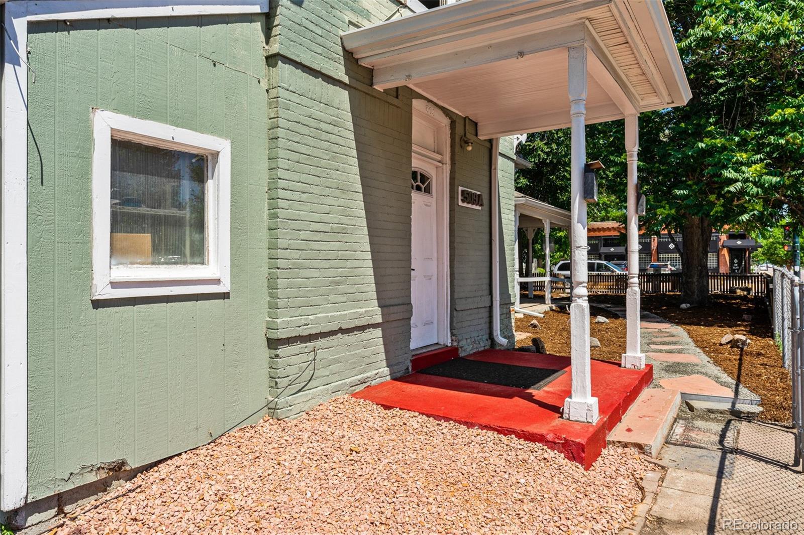 603 Elati Street Denver, CO 80204 - Photo 7 of 12 a balcony with a table and chairs