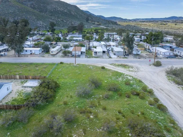 a view of a garden with mountains in the background