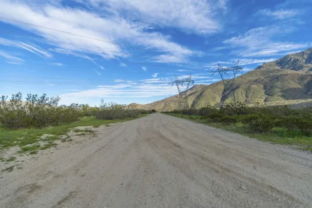 a view of a road with an ocean
