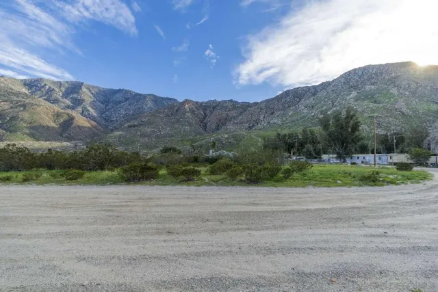 a view of a dry yard with mountain