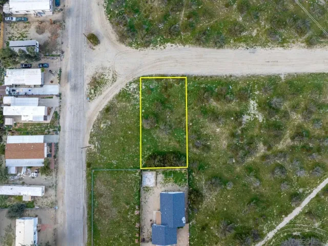 an aerial view of houses with yard