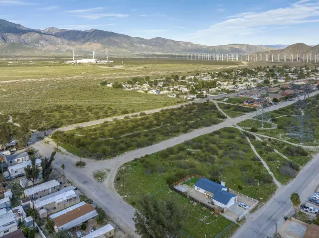 a view of a city with mountains in the background