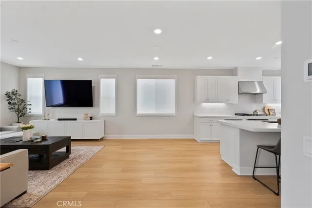a kitchen with a sink a stove a refrigerator and cabinets