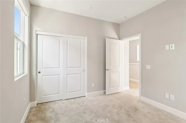 a close view of a utility room with dryer and washer