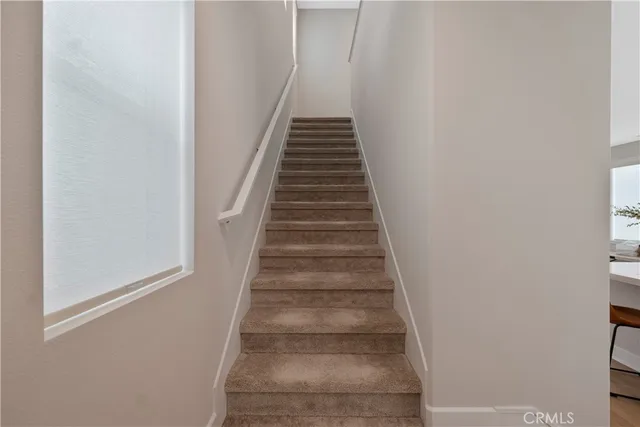 a kitchen with white cabinets