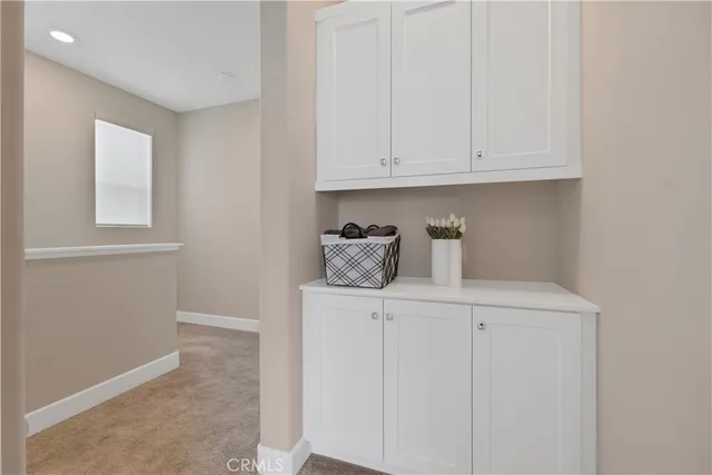 a view of an empty room and closet area