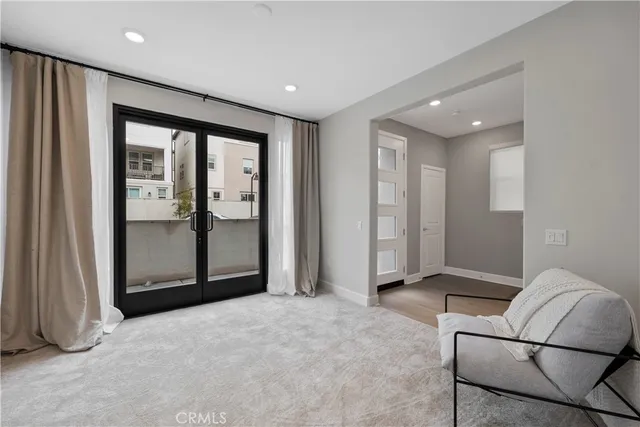 a view of empty room with wooden floor and cabinet