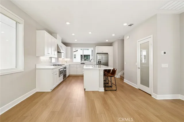 a kitchen with a table and chairs