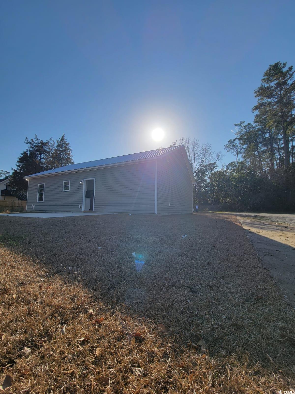 4967 Lyons Lane Longs, SC 29568 - Photo 2 of 9 View of property exterior featuring a patio area